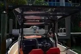 Slide: The Image of 2021 Nimbus T8 boat deck with teak finish and stainless steel railing. - 29