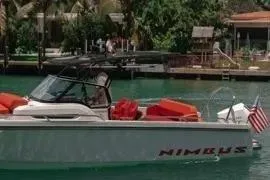 Slide: The Image of Nimbus T8 2021 boat with Mercury outboard engine on wooden deck. - 44