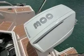 Slide: The Image of 2021 Nimbus T8 boat docked, featuring sleek design and wooden deck. - 45