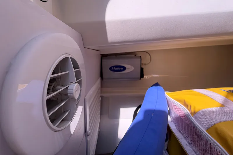 Slide: The Image of Interior of 2021 Nimbus T8 boat showing ventilation and storage area. - 46