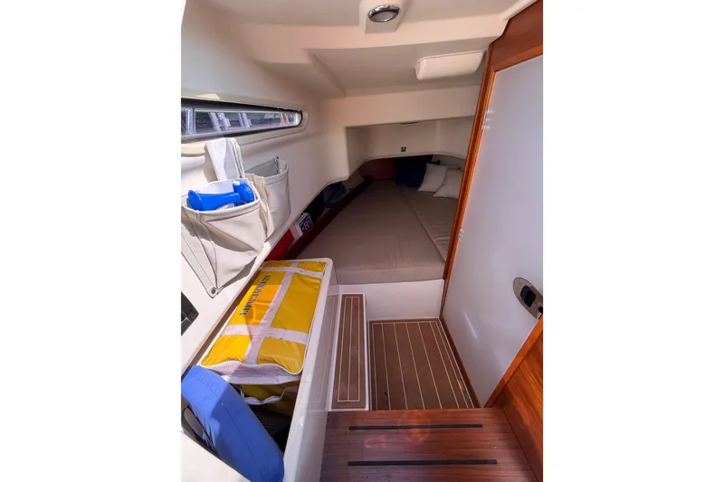 Slide: The Image of 2021 Nimbus T8 cabin interior with bed, storage, and wooden flooring. - 50