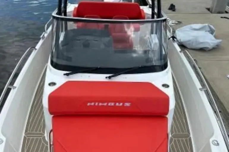 Slide: The Image of 2021 Nimbus T8 boat on water near tropical waterfront homes. - 8