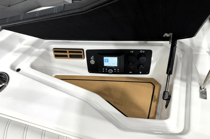 Slide: The Image of 2026 Nautique Ski Nautique boat dashboard with audio controls and sleek design. - 17