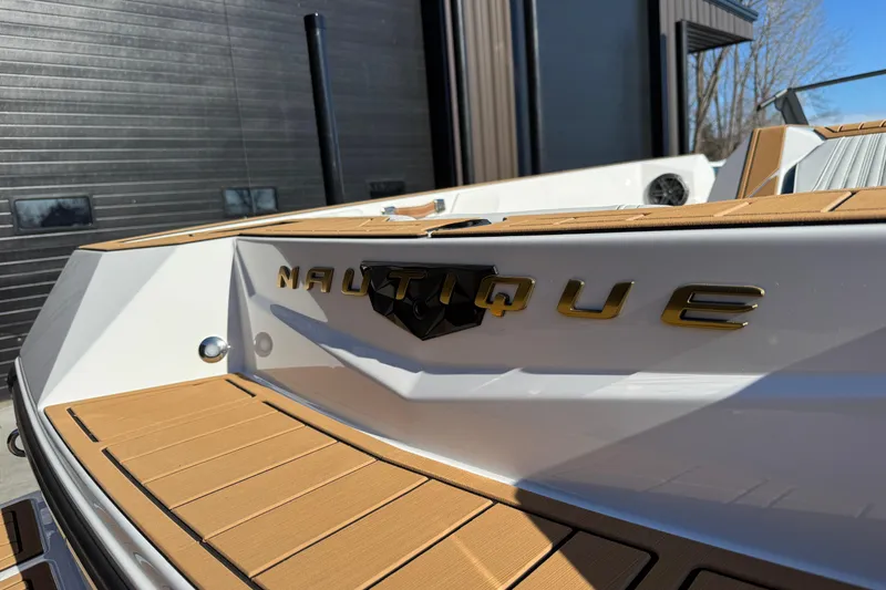 Slide: The Image of 2026 Nautique Ski Nautique boat with sleek design and modern detailing. - 25