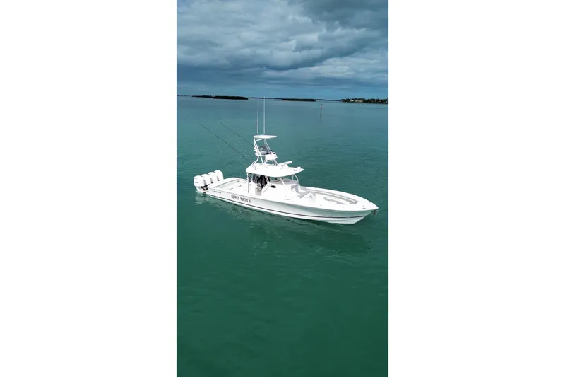 Slide: The Image of 2018 Regulator 41 boat on calm water under cloudy sky. - 10
