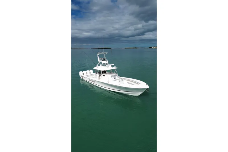 Slide: The Image of 2018 Regulator 41 boat on calm water under cloudy sky. - 11