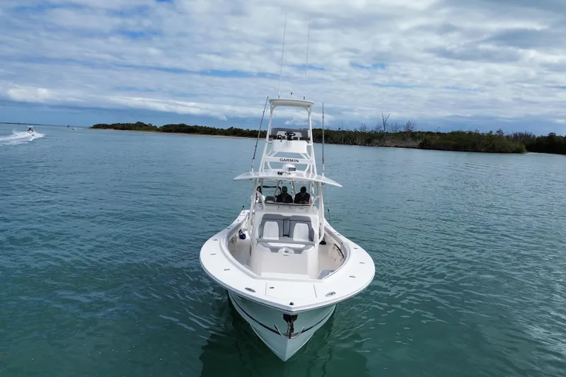 Slide: The Image of 2018 Regulator 41 boat on calm water under cloudy sky. - 16