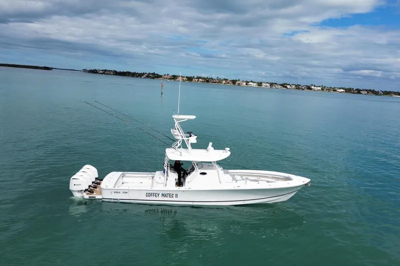 Slide: The Image of 2018 Regulator 41 boat on calm water under cloudy sky. - 2