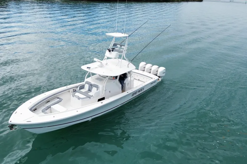Slide: The Image of 2018 Regulator 41 boat on calm water, featuring multiple outboard engines. - 3