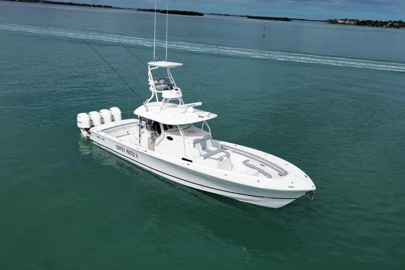 Slide: The Image of 2018 Regulator 41 boat on calm water, featuring multiple outboard engines. - 6