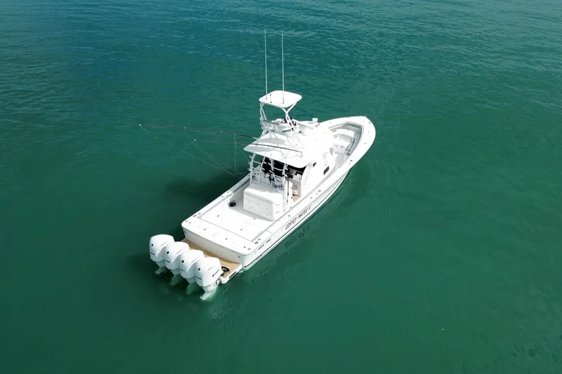 Slide: The Image of 2018 Regulator 41 boat with four engines on calm water. - 8