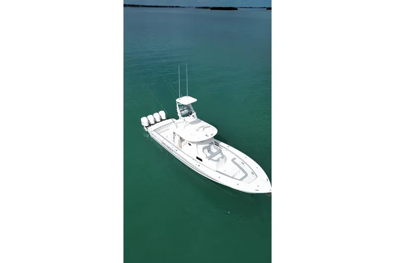 Slide: The Image of 2018 Regulator 41 boat on calm turquoise water, aerial view. - 9
