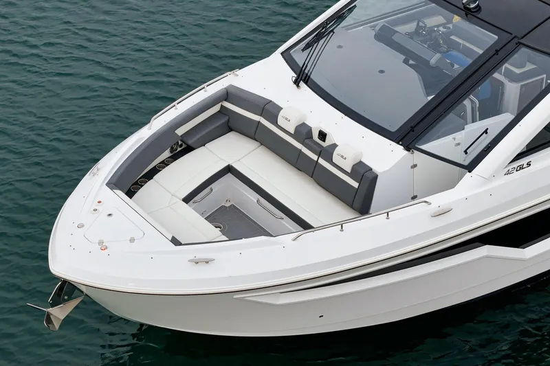 Slide: The Image of 2022 Cruisers 42 GLS luxury yacht on calm water, side view. - 14