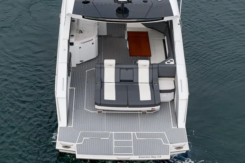 Slide: The Image of 2022 Cruisers 42 GLS luxury yacht on calm water, showcasing sleek design and modern features. - 20