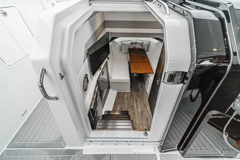 Slide: The Image of Luxurious 2022 Cruisers 42 GLS yacht bathroom with modern sink and wooden cabinetry. - 27