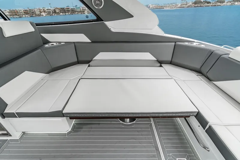 Slide: The Image of 2022 Cruisers 42 GLS yacht interior with bar stools and sleek countertop design. - 28