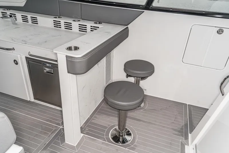 Slide: The Image of Luxurious interior of 2022 Cruisers 42 GLS yacht with modern amenities and cozy bedding. - 30