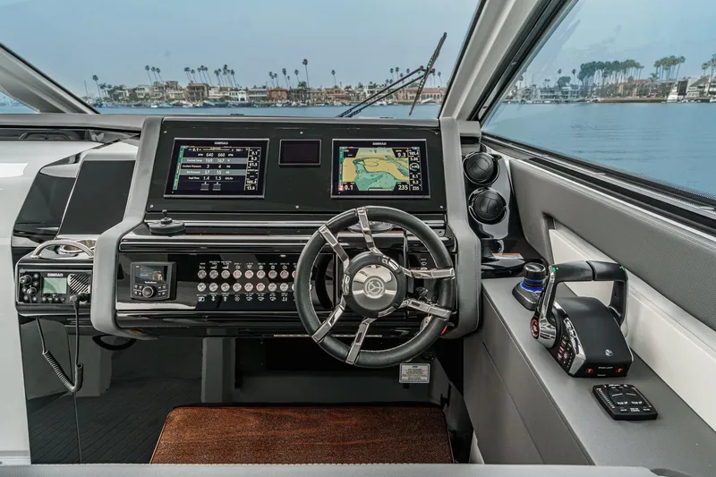 Slide: The Image of Interior of 2022 Cruisers 42 GLS yacht with modern seating and wooden table. - 34