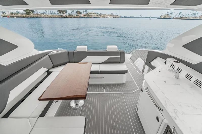 Slide: The Image of Luxurious interior of 2022 Cruisers 42 GLS yacht with modern seating and wood flooring. - 36