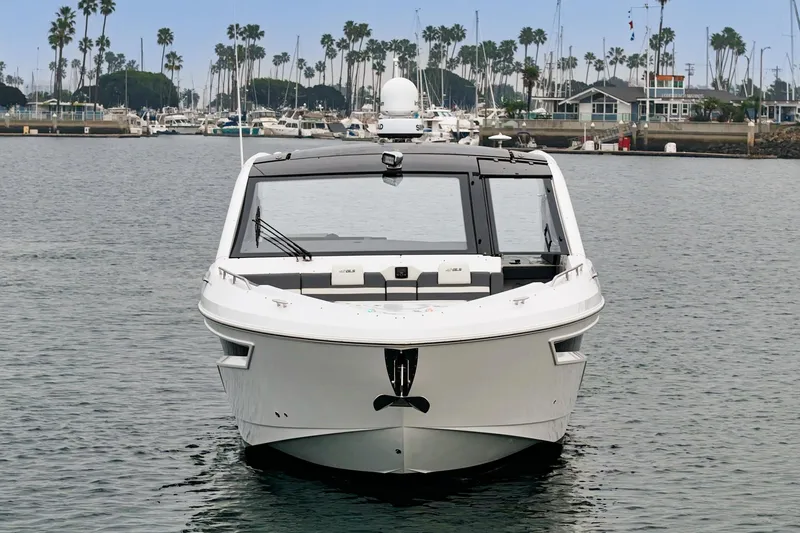 Slide: The Image of 2022 Cruisers 42 GLS luxury yacht on calm water, featuring sleek design and spacious deck. - 5