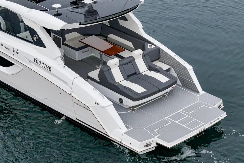 Slide: The Image of 2022 Cruisers 42 GLS boat with sleek design on calm water. - 10