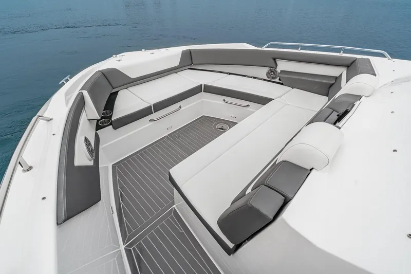 Slide: The Image of 2022 Cruisers 42 GLS luxury boat with spacious seating on calm water. - 11