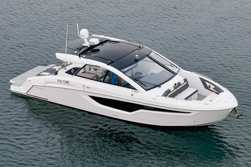 Slide: The Image of 2022 Cruisers 42 GLS yacht interior with sleek kitchenette and ocean view. - 23