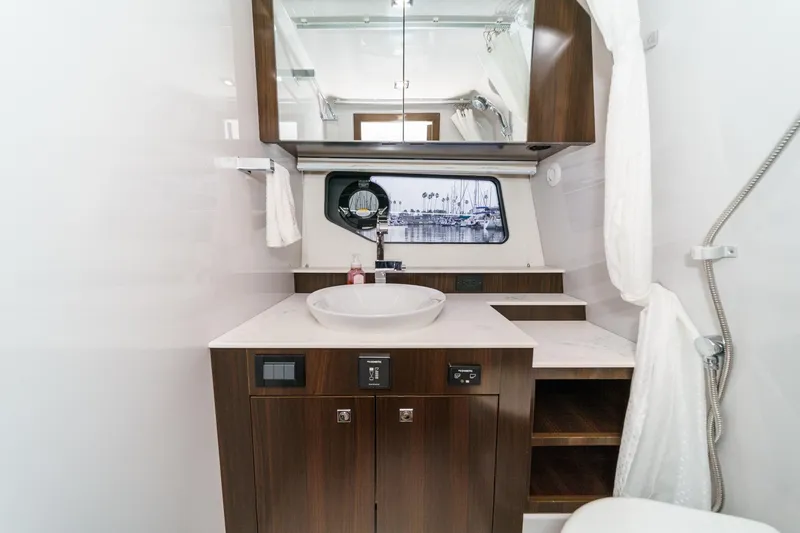 Slide: The Image of Engine compartment of 2022 Cruisers 42 GLS boat, featuring dual V8 engines and battery setup. - 29