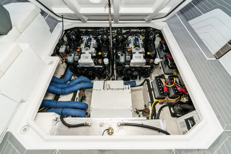 Slide: The Image of Open mini fridge on 2022 Cruisers 42 GLS boat, showcasing interior storage space. - 31