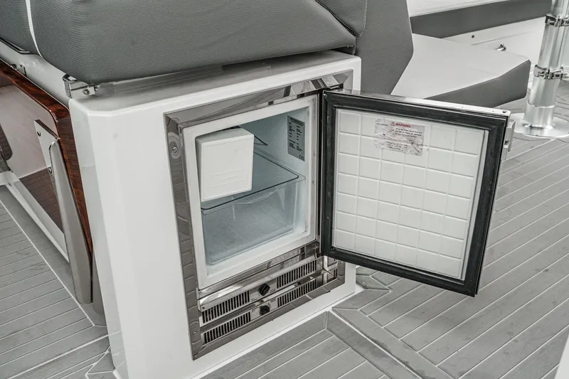 Slide: The Image of Cockpit of 2022 Cruisers 42 GLS yacht with advanced navigation systems and controls. - 33