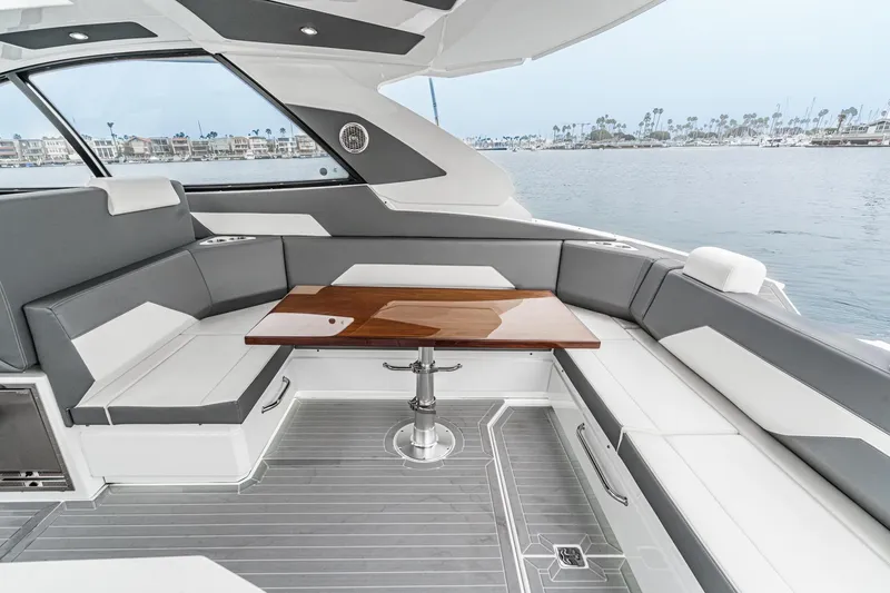 Slide: The Image of Engine compartment of 2022 Cruisers 42 GLS yacht, featuring dual engines and mechanical components. - 44