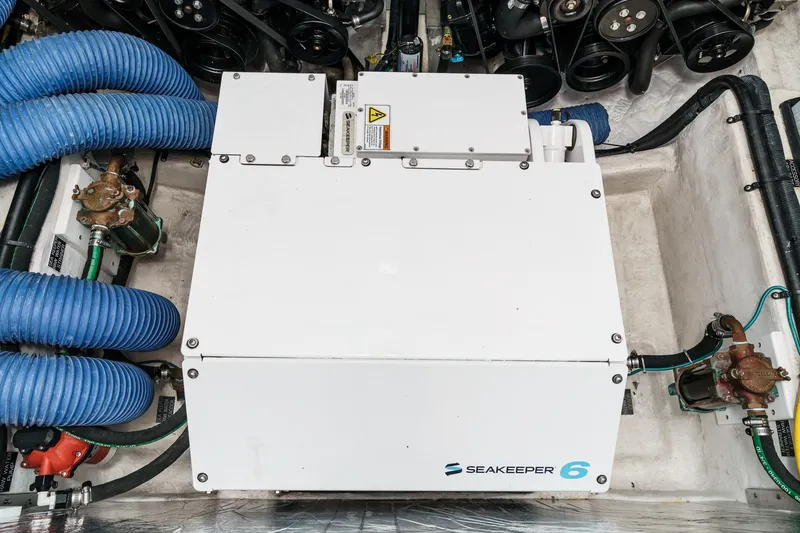 Slide: The Image of Interior of 2022 Cruisers 42 GLS yacht with modern seating and wooden table. - 52