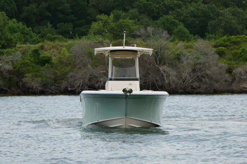 The Image of 2021 Grady-White Fisherman 236 boat on water, surrounded by lush greenery. - 0