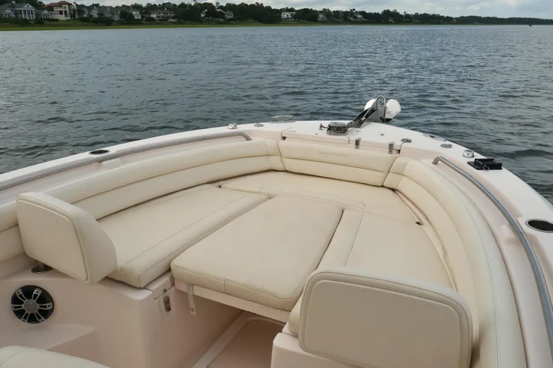 Slide: The Image of 2021 Grady-White Fisherman 236 boat with spacious seating on calm water. - 7