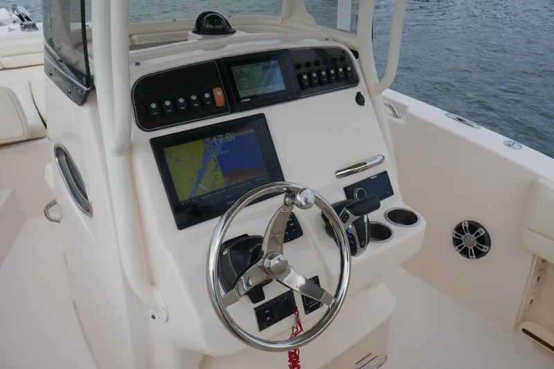 Slide: The Image of 2021 Grady-White Fisherman 236 boat console with navigation system and steering wheel. - 9