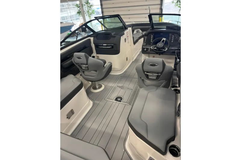 Slide: The Image of 2026 Chaparral SSX 6 boat interior with modern seating and sleek dashboard design. - 14