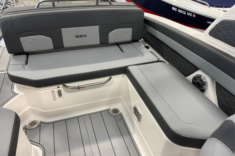 Slide: The Image of 2026 Chaparral SSX 6 boat interior with gray seating and diamond-patterned accents. - 16