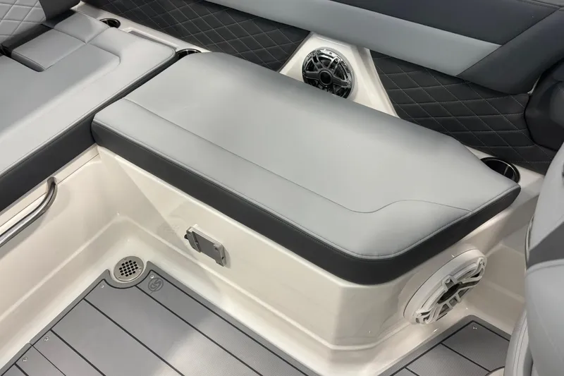 Slide: The Image of 2026 Chaparral SSX 6 boat interior with gray seating and speaker system. - 18