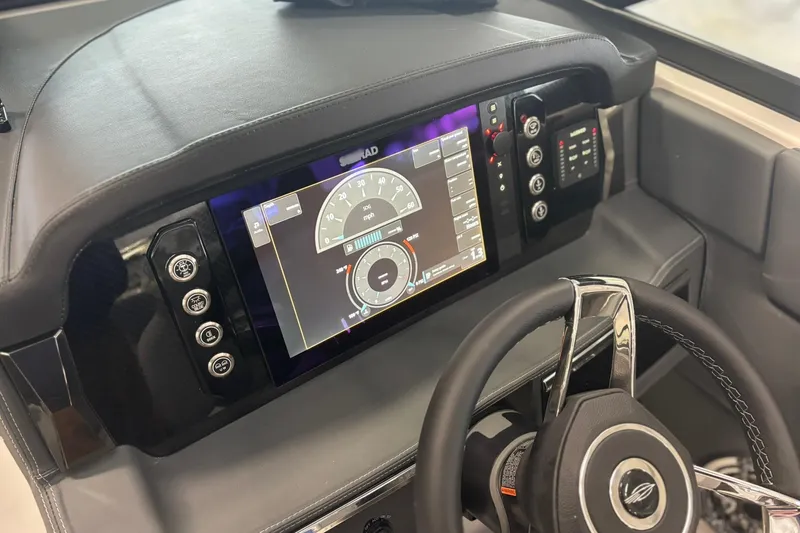 Slide: The Image of 2026 Chaparral SSX 6 dashboard with digital display and steering wheel. - 23