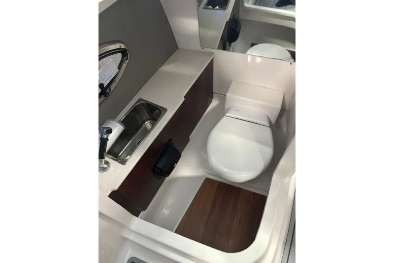 Slide: The Image of 2026 Chaparral SSX 6 boat bathroom with sink, toilet, and modern design. - 27