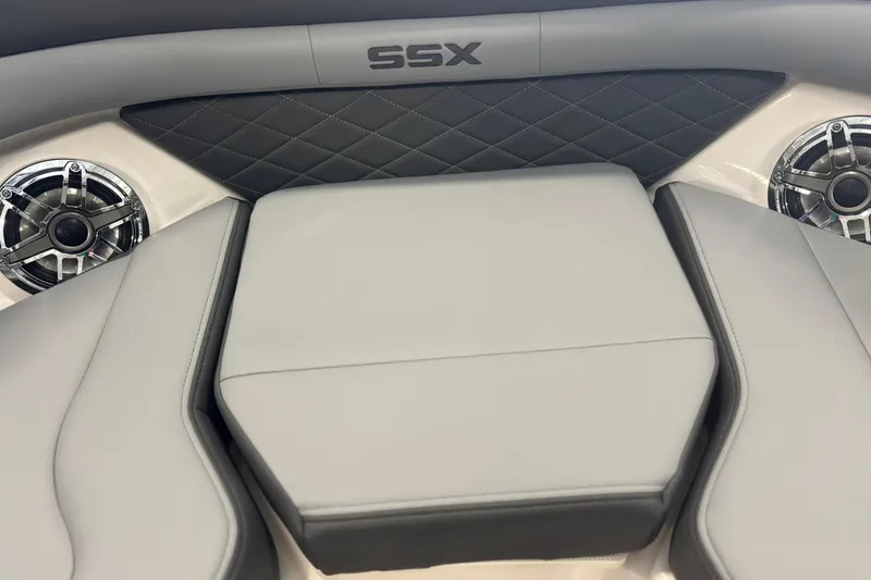 Slide: The Image of 2026 Chaparral SSX 6 boat interior with gray seating and speakers. - 32