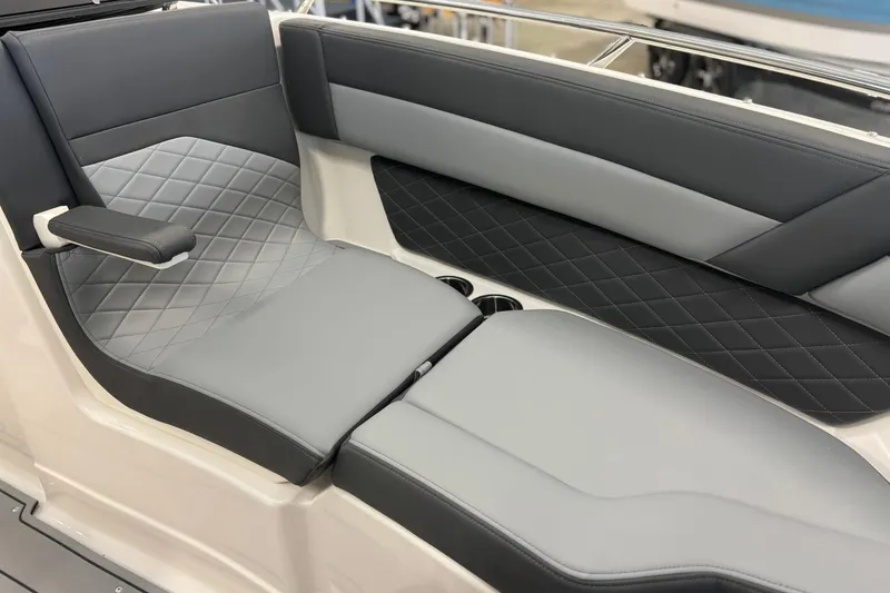 Slide: The Image of 2026 Chaparral SSX 6 boat interior with luxurious gray quilted seating. - 33