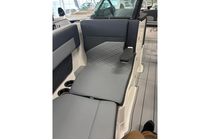 Slide: The Image of 2026 Chaparral SSX 6 boat interior with sleek gray seating and cup holders. - 34