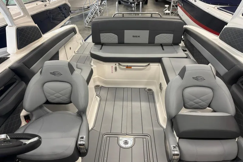 Slide: The Image of 2026 Chaparral SSX 6 boat interior with luxurious gray seating and modern design. - 36