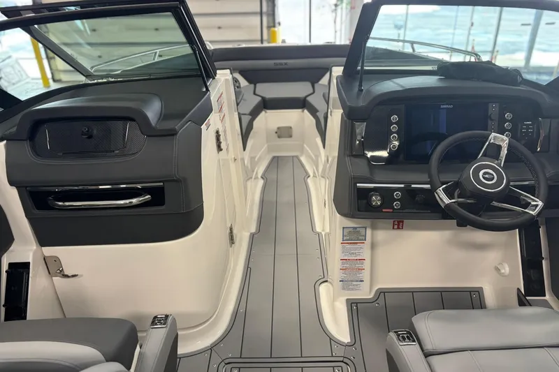 Slide: The Image of 2026 Chaparral SSX 6 boat interior with modern dashboard and steering wheel. - 39