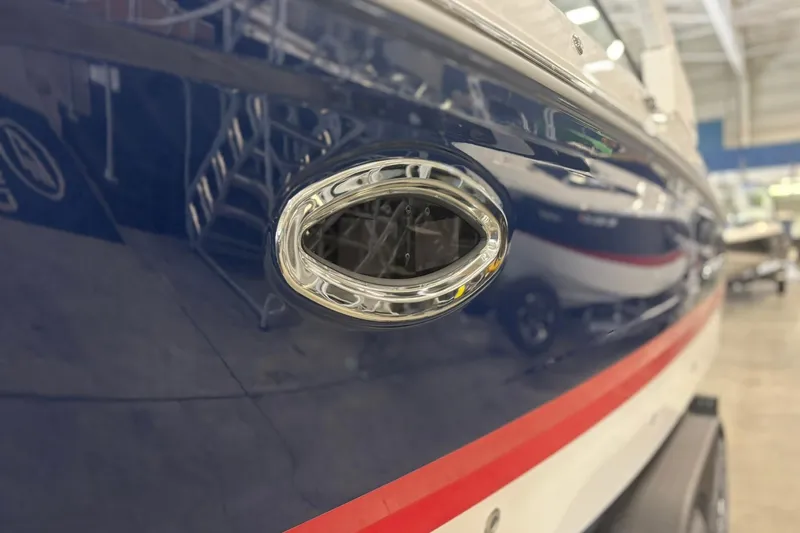 Slide: The Image of 2026 Chaparral SSX 6 boat detail with sleek chrome and blue finish. - 5