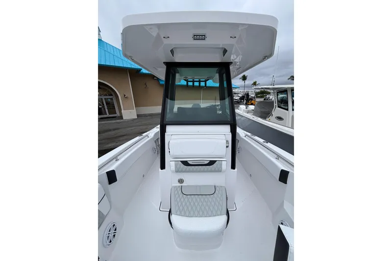 Slide: The Image of 2025 Blackfin 252 CC boat interior with modern console and seating. - 4