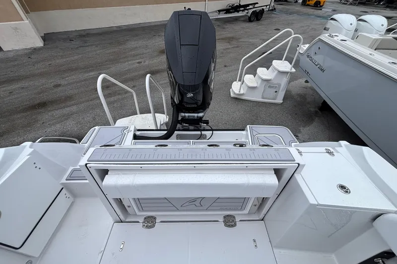 Slide: The Image of 2025 Blackfin 252 CC boat with outboard motor and fishing station. - 6
