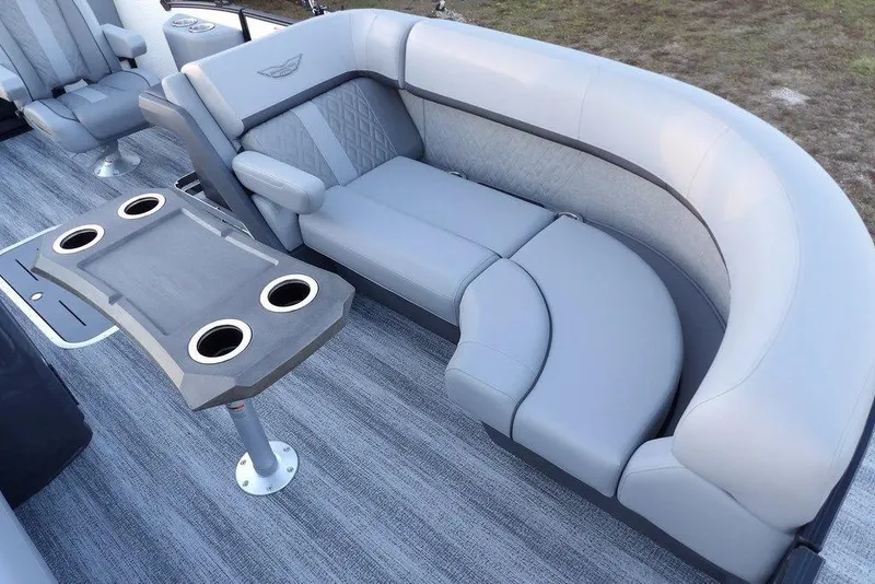 Slide: The Image of 2026 Bennington M Swingback 22 MSB boat interior with plush seating and cup holders. - 13