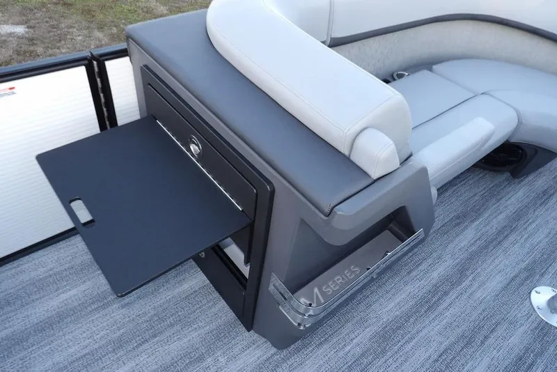 Slide: The Image of 2026 Bennington M Swingback 22 MSB boat interior with pull-out tray and seating. - 18